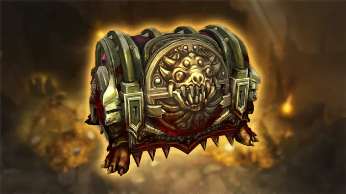 Ornate Diablo Treasure Goblin chest with a golden demonic face emblem and clawed feet, glowing against a gold-lit cavern background