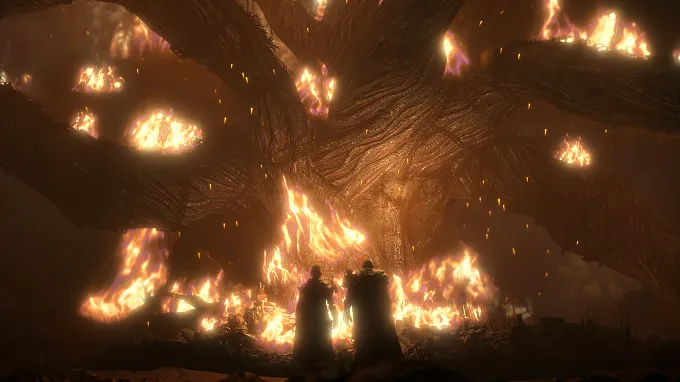 Two figures stand before the burning Tree of Whispers during a Diablo 4 cutscene.