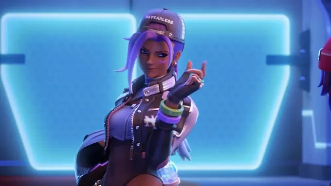 Sombra from Overwatch with a streeetwaear cosmetic making a sign with her hand to another character
