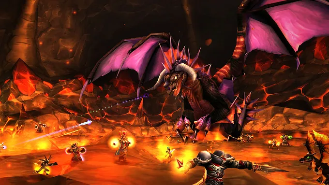 A raid group of players casting spells and attacking Onyxia in her lava-filled lair in World of Warcraft